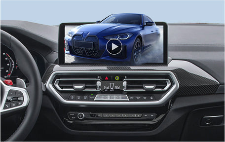 Car dashboard display showing video of blue BMW on Ottocast wireless CarPlay adapter screen
